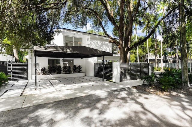 exterior space with a carport