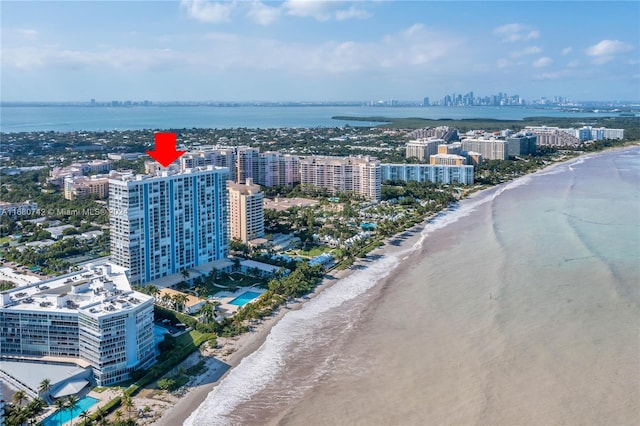 bird's eye view featuring a water view and a view of the beach