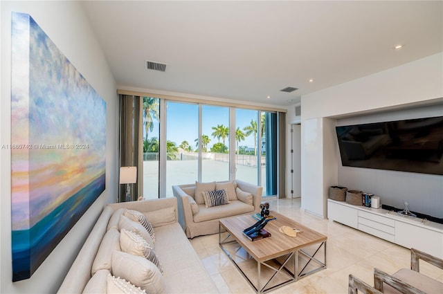 tiled living room with floor to ceiling windows