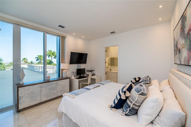 tiled bedroom with access to exterior and ensuite bath