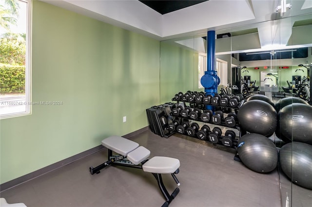 exercise room featuring concrete floors