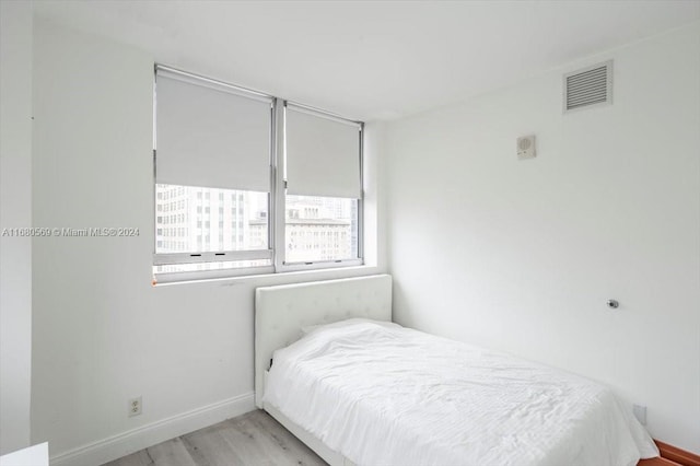 bedroom with light wood-type flooring