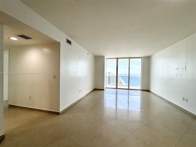 1830 S Ocean Dr Unit 4711, Hallandale Beach, FL 33009 - empty room featuring light tile patterned floors, visible vents, and expansive windows