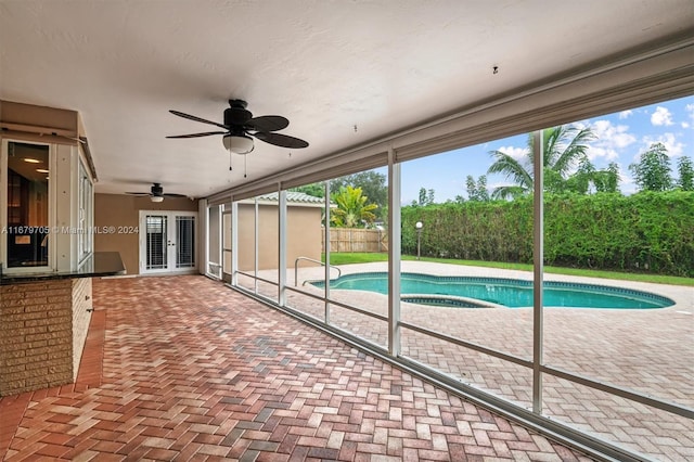 view of pool with ceiling fan and a patio area