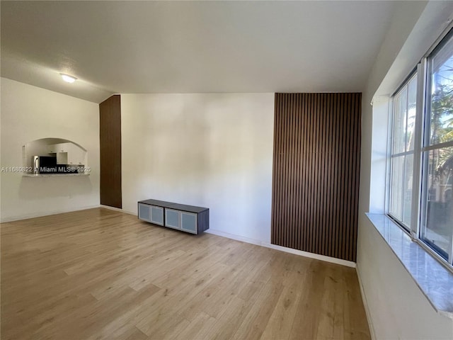 unfurnished room featuring light wood-type flooring