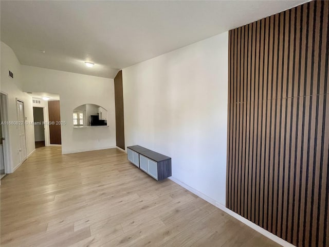 unfurnished room featuring light hardwood / wood-style floors