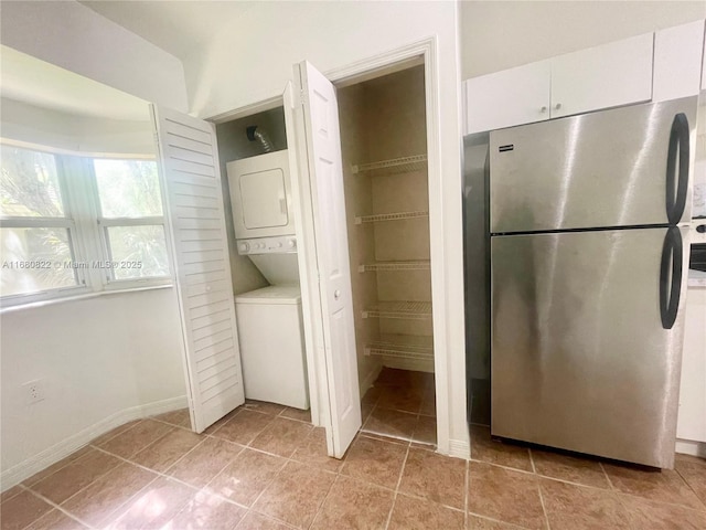 interior space featuring stacked washer / drying machine