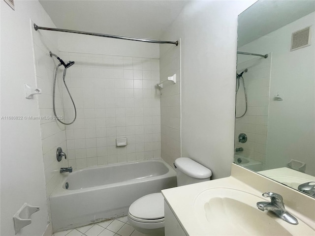 full bathroom with tile patterned flooring, vanity, toilet, and tiled shower / bath