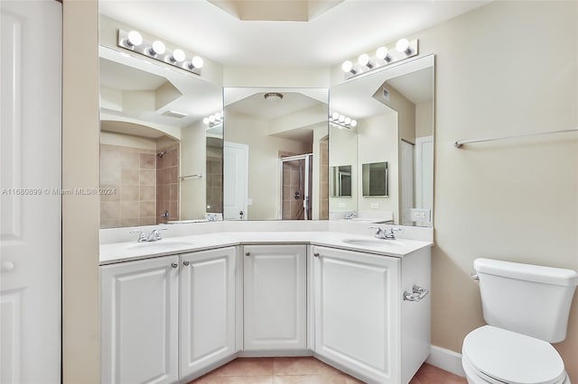 4 Renaissance Way Unit 303, Boynton Beach, FL 33426 - full bathroom with tiled shower, tile patterned flooring, toilet, and double vanity