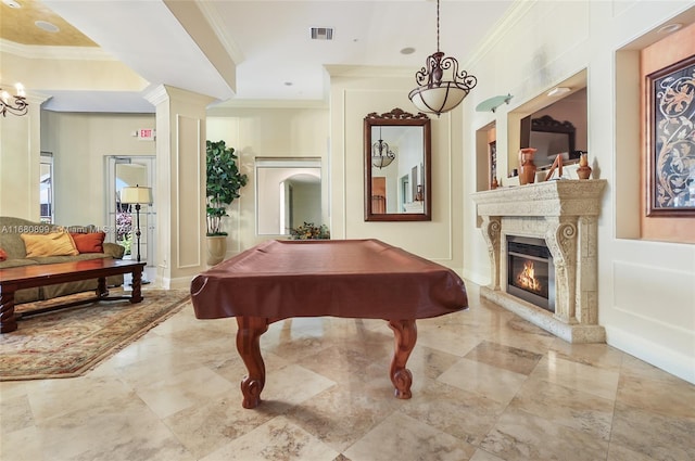 recreation room featuring a premium fireplace, crown molding, and billiards