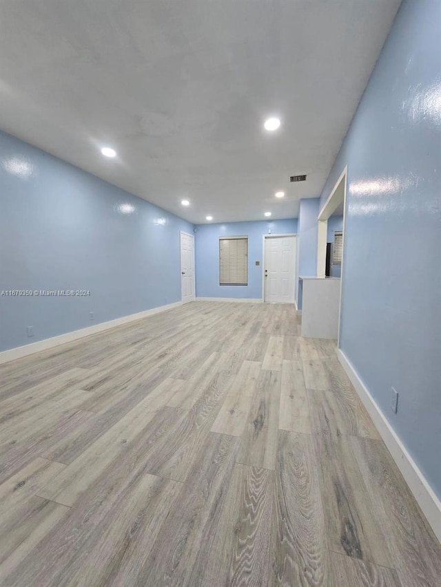 unfurnished room featuring light wood-type flooring