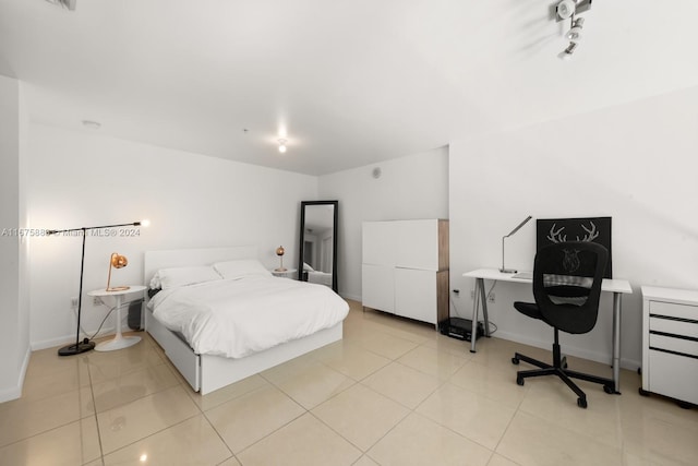 bedroom with light tile patterned floors