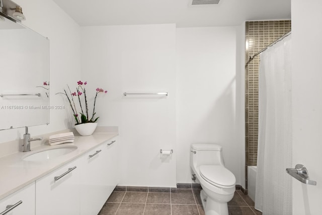 full bathroom with vanity, toilet, tile patterned floors, and shower / bath combo