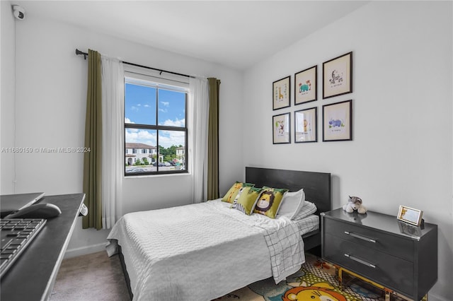 bedroom featuring dark colored carpet