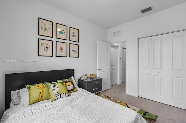 carpeted bedroom featuring a closet