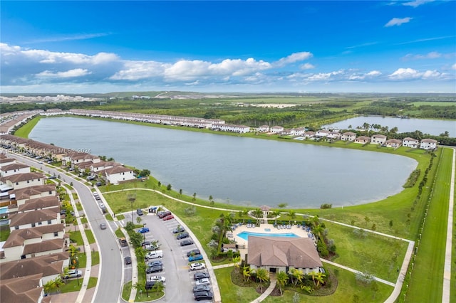 birds eye view of property with a water view