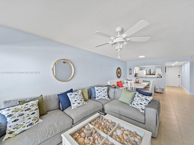 tiled living room featuring ceiling fan