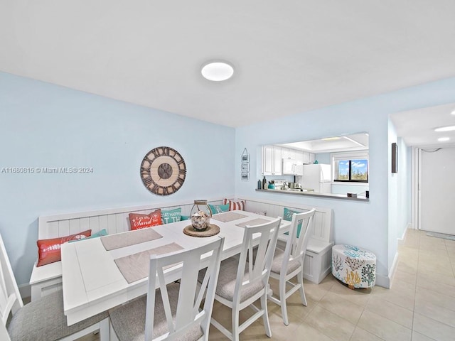 dining area with light tile patterned flooring