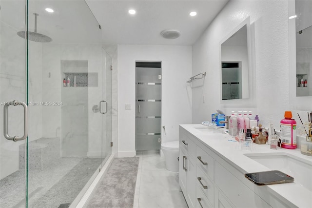 bathroom with toilet, walk in shower, and vanity