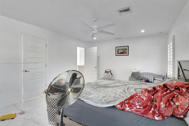 bedroom with multiple windows and ceiling fan