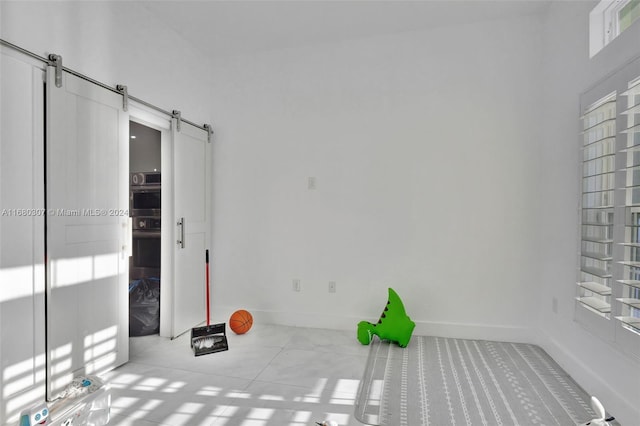 empty room featuring a barn door