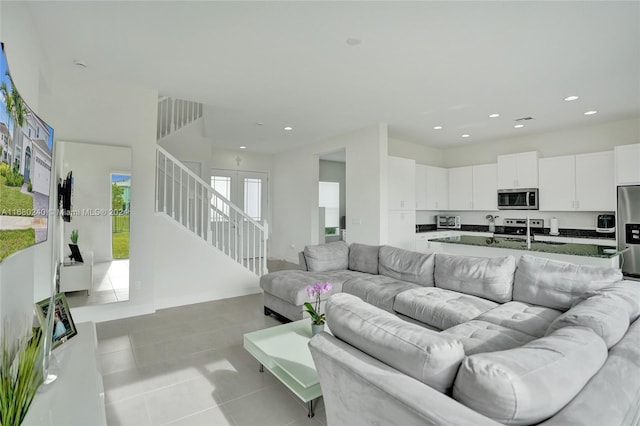 living room featuring light tile patterned flooring