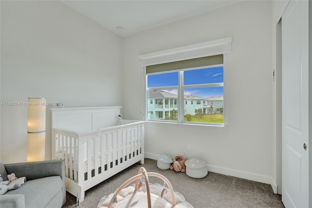 bedroom with carpet floors and a nursery area