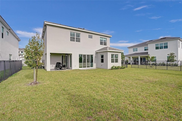 rear view of property with a yard