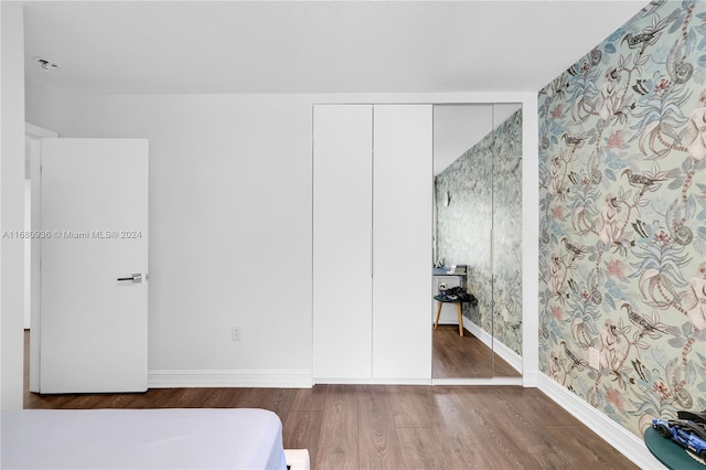 bedroom featuring a closet and wood-type flooring