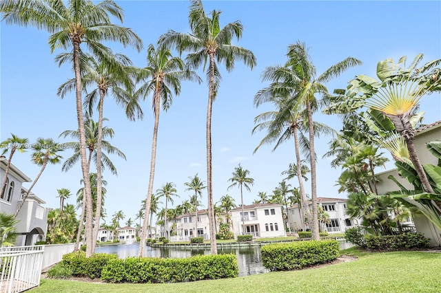 exterior space with a water view and a yard