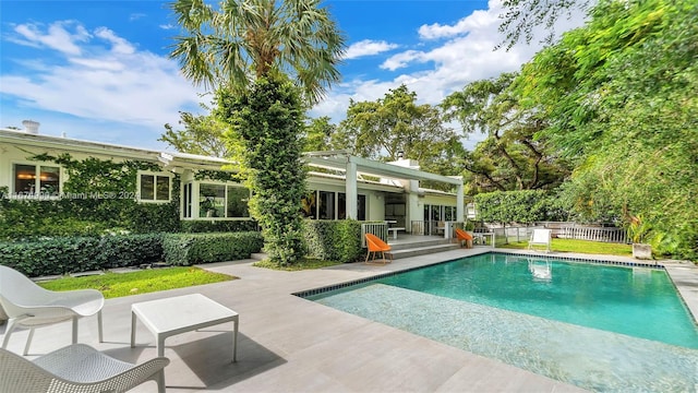 view of swimming pool with a patio area