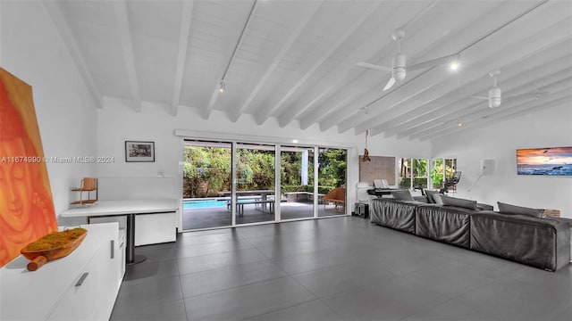 living room featuring lofted ceiling with beams and ceiling fan