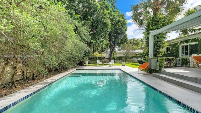 view of swimming pool featuring a patio