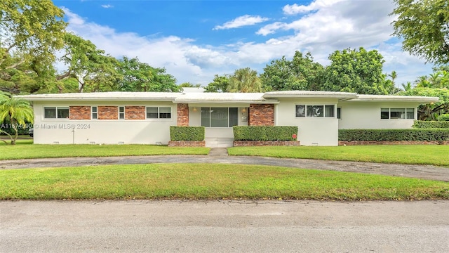 ranch-style home with a front yard