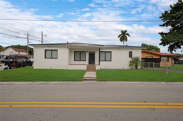 view of front of property with a front lawn