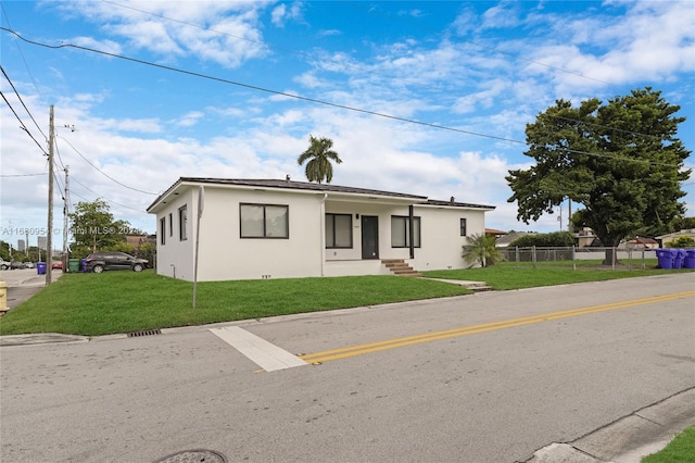 bungalow-style home featuring a front yard