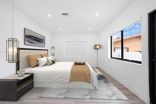 bedroom with light wood-type flooring