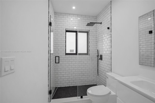 bathroom with vanity, an enclosed shower, and toilet