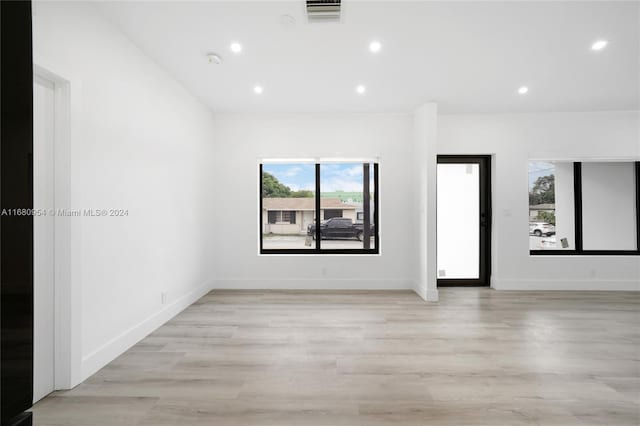 spare room featuring light hardwood / wood-style floors