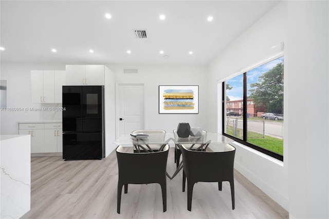 dining room featuring light hardwood / wood-style floors