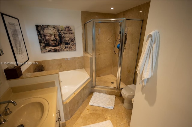 full bathroom featuring toilet, plus walk in shower, vanity, and tile patterned flooring