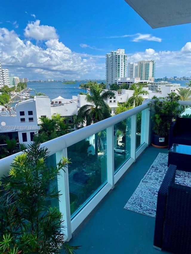 balcony featuring a water view