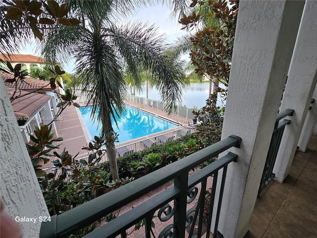 view of pool featuring a water view