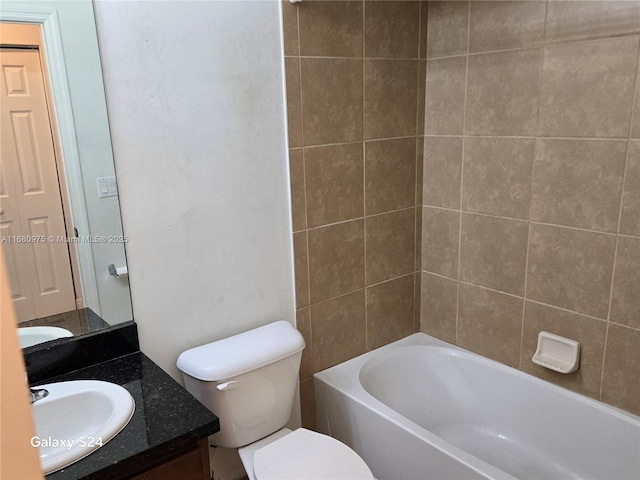 full bathroom featuring vanity, toilet, and tiled shower / bath combo