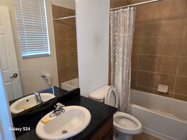 full bathroom featuring toilet, vanity, and shower / bathtub combination with curtain