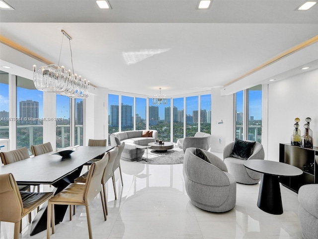 interior space featuring an inviting chandelier, a wealth of natural light, and a wall of windows