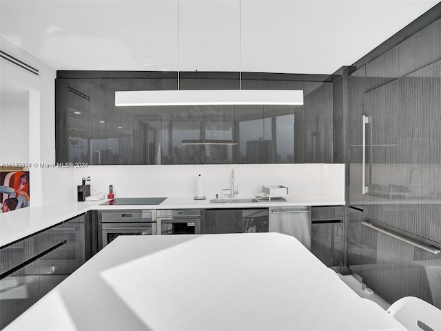 kitchen with sink and appliances with stainless steel finishes