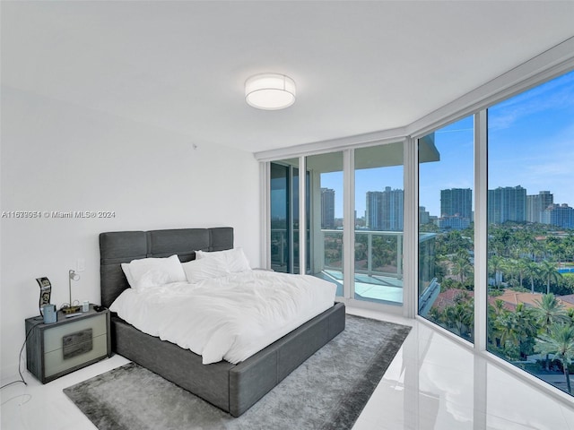 bedroom with floor to ceiling windows