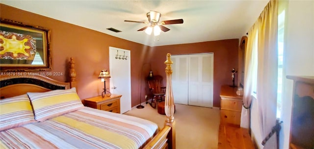 bedroom featuring ceiling fan and a closet