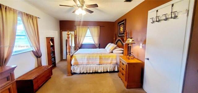 bedroom with light carpet and ceiling fan